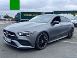 a grey mercedes cla is parked in a parking lot