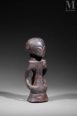 an image of a statue of a man holding a guitar