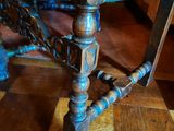 a close up of a chair on a wooden floor