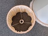 a basket of coffee beans on the floor next to a mirror