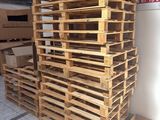 pallets stacked on top of each other in front of a store