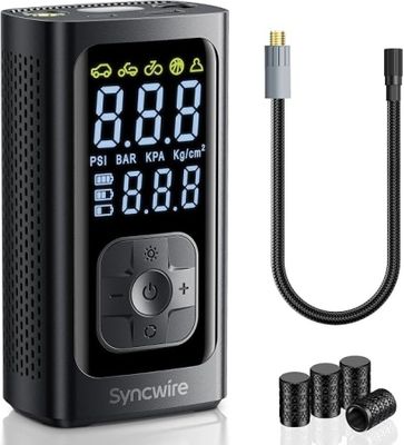 a digital clock with a cable connected to it next to a charger
