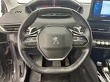 the interior of a car with a steering wheel and dashboard controls