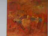 a painting hanging on a wall in a room