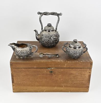 three pieces of silverware sitting on top of a wooden box