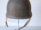 a helmet that is sitting on a stand on a table
