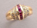 an image of a gold ring with rubies and diamonds