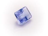 a square blue sapphire stone on a white background