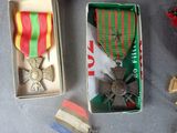 boxes with medals and ribbons are sitting on a table