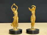 pair of art deco bronze figurines of a woman and a man