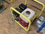 two portable generators sitting on the floor in the garage