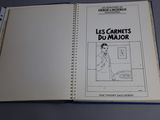 opened book with a drawing of a woman in a kitchen