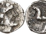 a close up of a silver coin with a bird on it