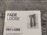 the label is on the back of a pair of jeans