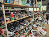 many different types of electronics on the shelves in this room
