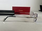 a pair of glasses sitting on a table next to a red box