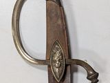 a very old sword that is hanging on the wall