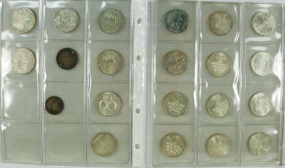 several different types of coins are in a clear plastic case