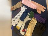 several pairs of gloves are laid out on a table