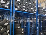 a lot of tires on the shelves in the warehouse