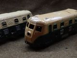 three toy trains sitting next to each other on a table