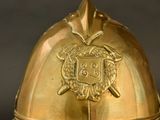 a gold helmet with a crest on it