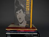 books stacked on top of each other on a gray surface