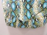 an image of a snake skin purse hanging on a wall