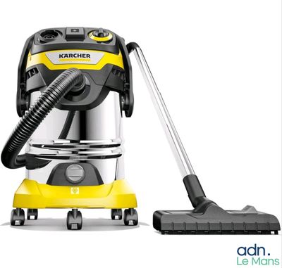 un aspirateur jaune avec un tuyau noir à côté