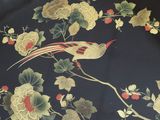 a bird sitting on a branch of a tree with flowers