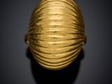 an image of a gold ring on a black background