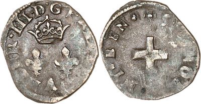 a silver coin with a cross on the front and a crown on the back