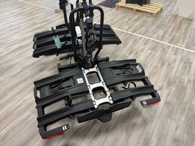 a bike that is attached to the back of a cart