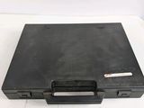 an open black briefcase sitting on top of a white table