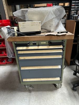 an image of a workbench with a lot of tools on it