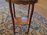 a small table with a marble top in a living room