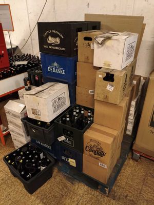 a lot of boxes and boxes of beer on the floor