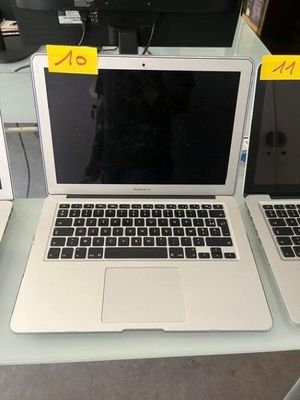 two laptops that are sitting on a table
