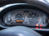 a close up of a car dashboard with a speedometer