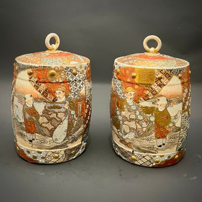 two vases that are sitting on a table