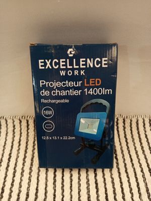 an image of a box of excellence work light on a bed