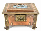 a small wooden box with a decorative design on it