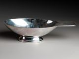 an image of a silver bowl with a spoon sticking out of it