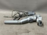 an image of a corded blow dryer sitting on top of a table