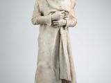 statue représentant un homme coiffé d'une couronne et accompagné d'un chien