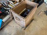 a wicker basket with a bottle of wine inside of it