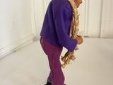 a figurine of a person with a hat and scarf