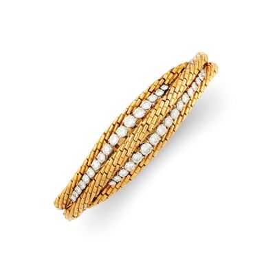 a diamond and eighteen karat gold bang bracelet
