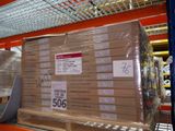 a large stack of boxes sitting on a shelf in a warehouse