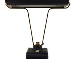 a black and gold desk lamp with a metal base